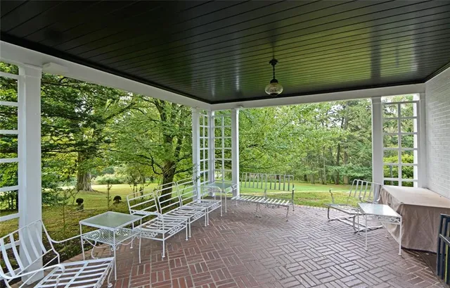 a view of a swimming pool with a yard