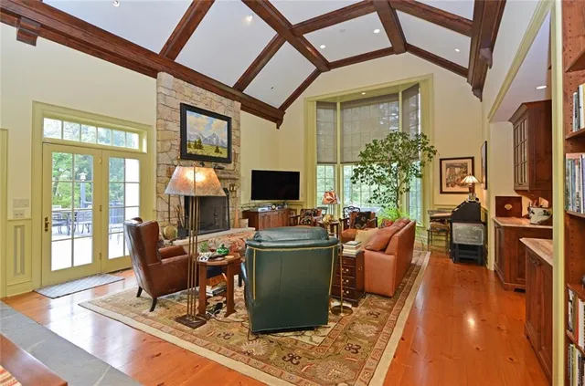 a view of a porch with dining table and chairs