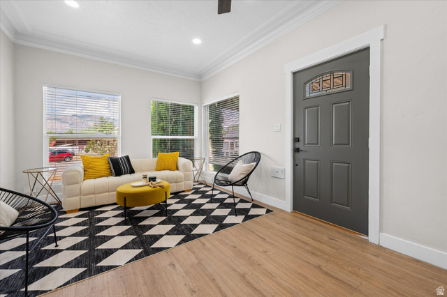 327 35th Street Ogden, UT 84401 - Photo 5 of 31 Entryway and living area featuring wood-finish flooring, a paneled entry door with decorative glass insert, multiple large windows with blinds, and recessed lighting