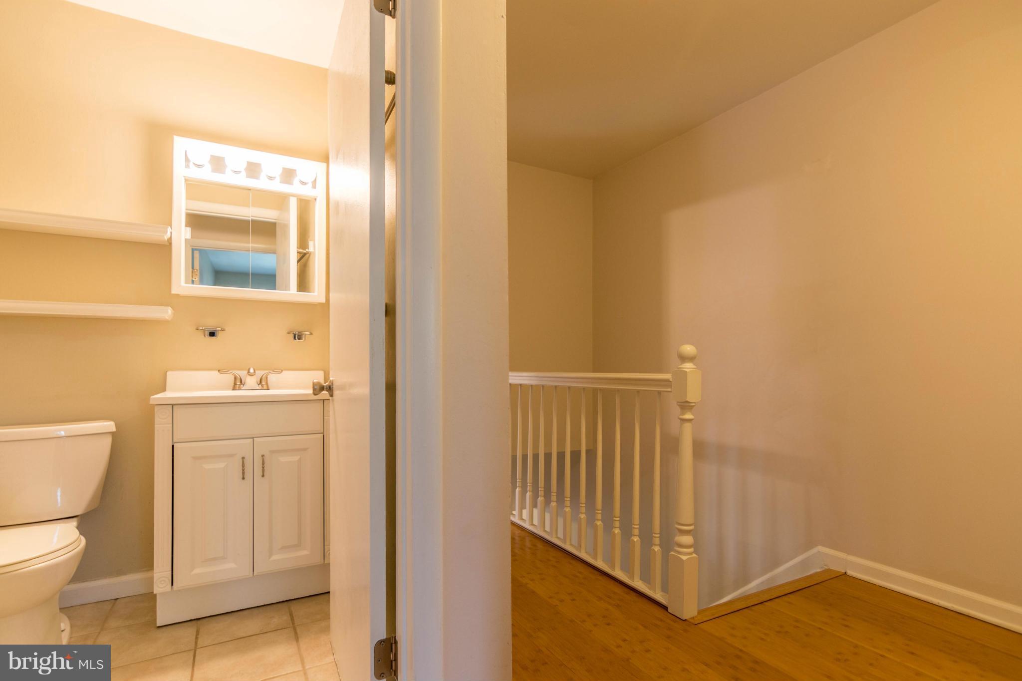 1017 Cedar Ridge Court Annapolis, MD 21403 - Photo 11 of 20 a bathroom with a toilet and a sink
