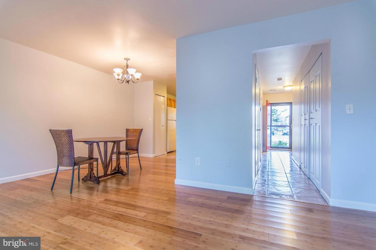 1017 Cedar Ridge Court Annapolis, MD 21403 - Photo 4 of 20 a view of a dining room with furniture and wooden floor