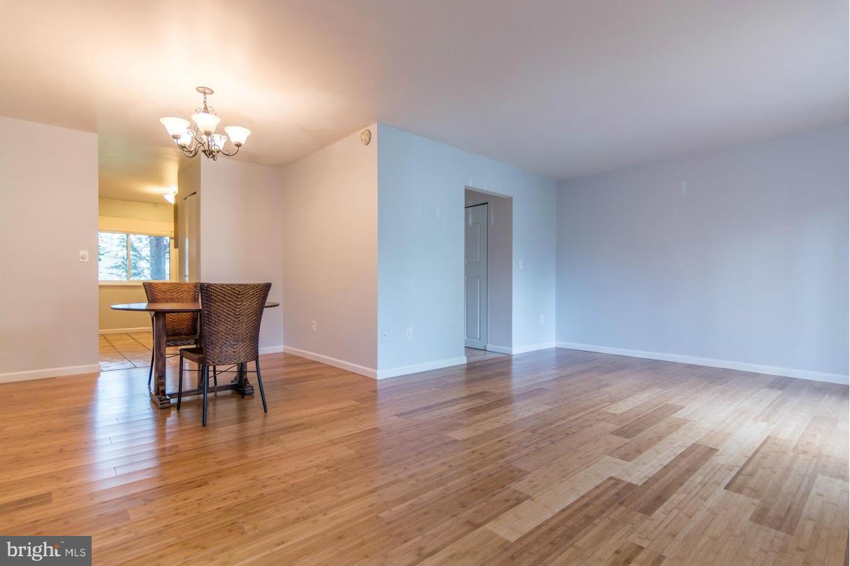 1017 Cedar Ridge Court Annapolis, MD 21403 - Photo 5 of 20 a view of a dining room with furniture and wooden floor