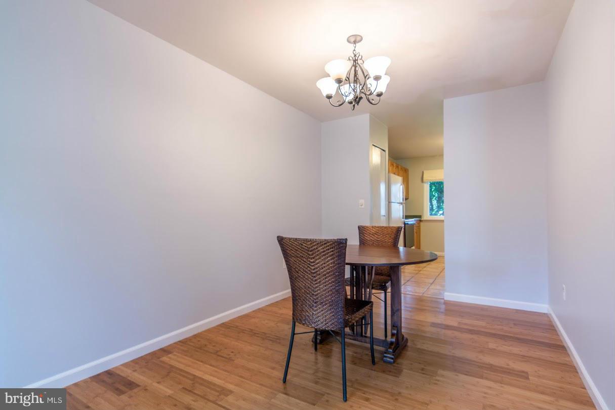 1017 Cedar Ridge Court Annapolis, MD 21403 - Photo 6 of 20 a view of a dining room with furniture and chandelier