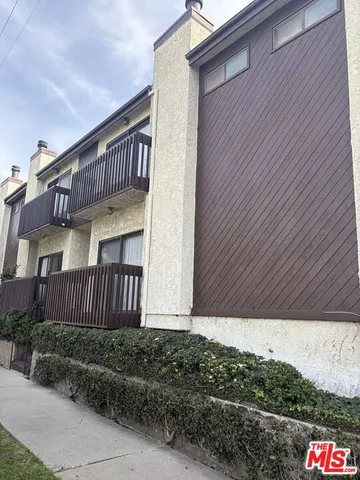 a kitchen with a stove a sink and a refrigerator