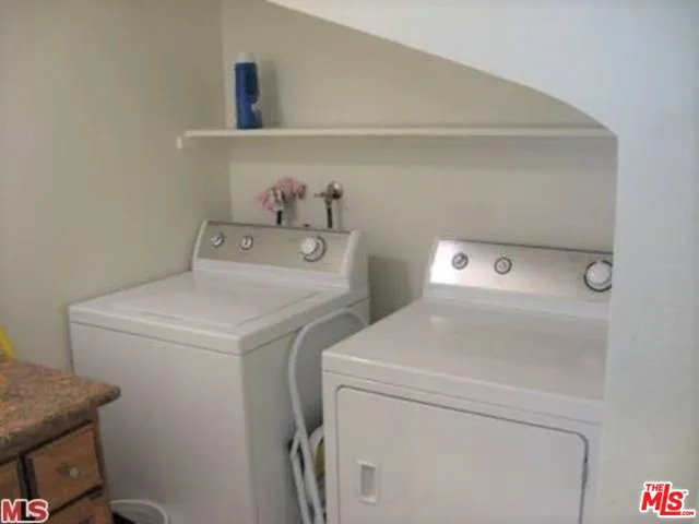 an entryway and livingroom with furniture