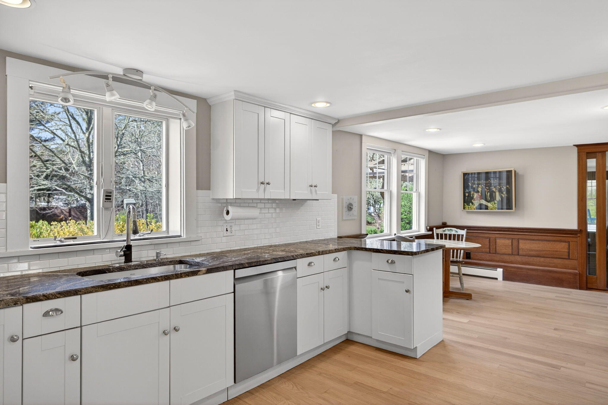 69 County Road Bourne, MA 02532 - Photo 8 of 54 a kitchen with granite countertop cabinets a stove a sink and a large window