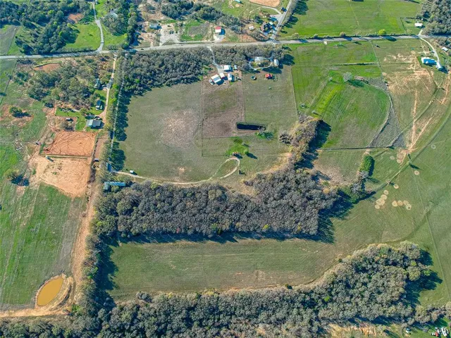 an aerial view of a houses with outdoor space