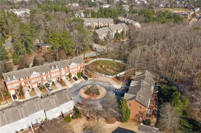 an aerial view of a house with yard swimming pool and outdoor seating
