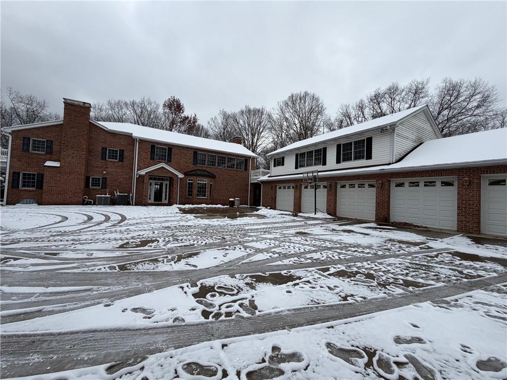 a view of a house with a snow in the yard