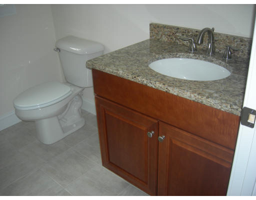 38 Standish Road Arlington, MA 02478 - Photo 14 of 24 a bathroom with a granite countertop sink a toilet and a mirror