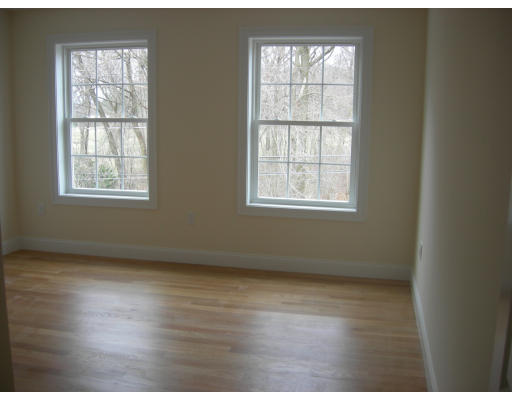 38 Standish Road Arlington, MA 02478 - Photo 17 of 24 an empty room with wooden floor and windows