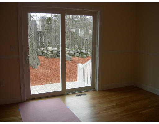 38 Standish Road Arlington, MA 02478 - Photo 4 of 24 an empty room with wooden floor and windows