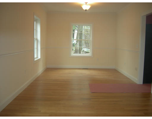 38 Standish Road Arlington, MA 02478 - Photo 5 of 24 an empty room with wooden floor and windows