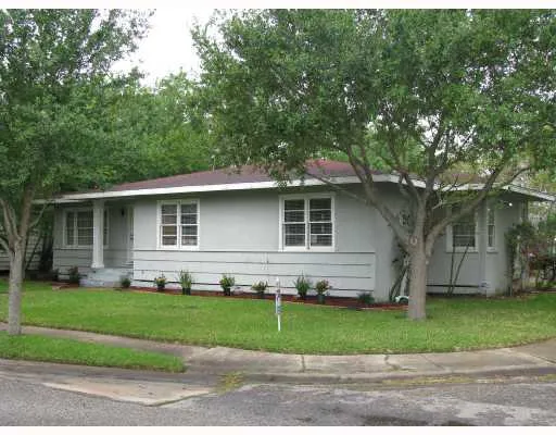 a view of a yard in front of a house with garage