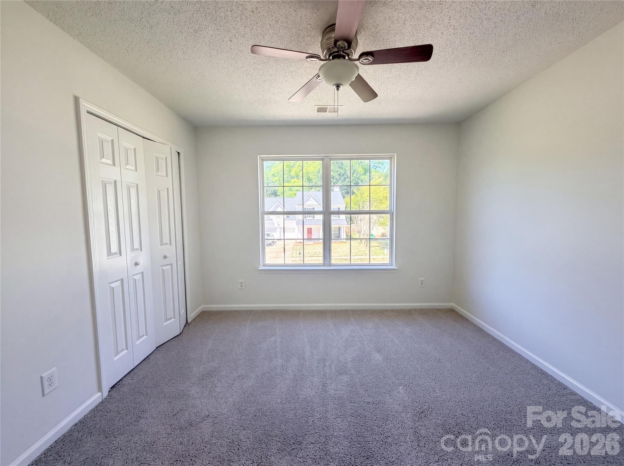 7423 Henderson Park Road Huntersville, NC 28078 - Photo 10 of 16 a view of an empty room with a window