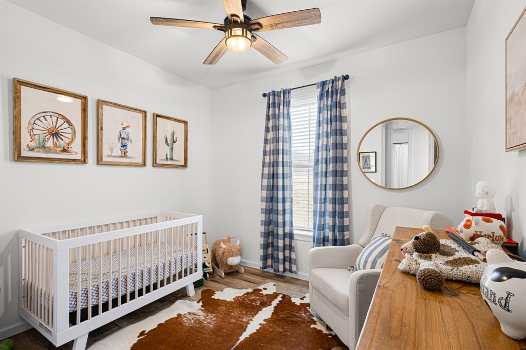 476 Silverleaf Drive Sunset, TX 76270 - Photo 17 of 40 a bedroom with furniture and a large window