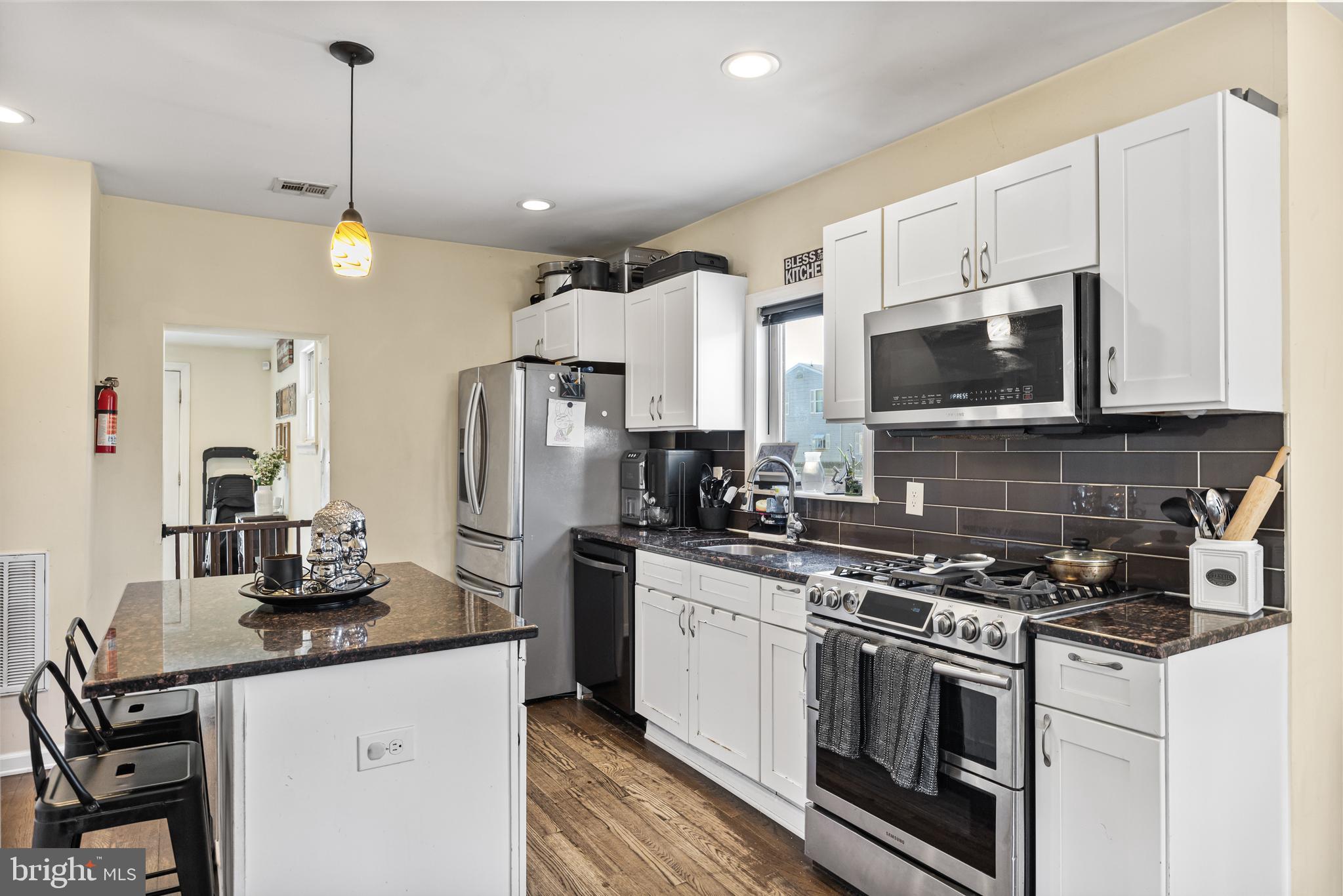 148 Cross Keys Road Berlin, NJ 08009 - Photo 11 of 36 a kitchen with stainless steel appliances a stove a sink and a refrigerator