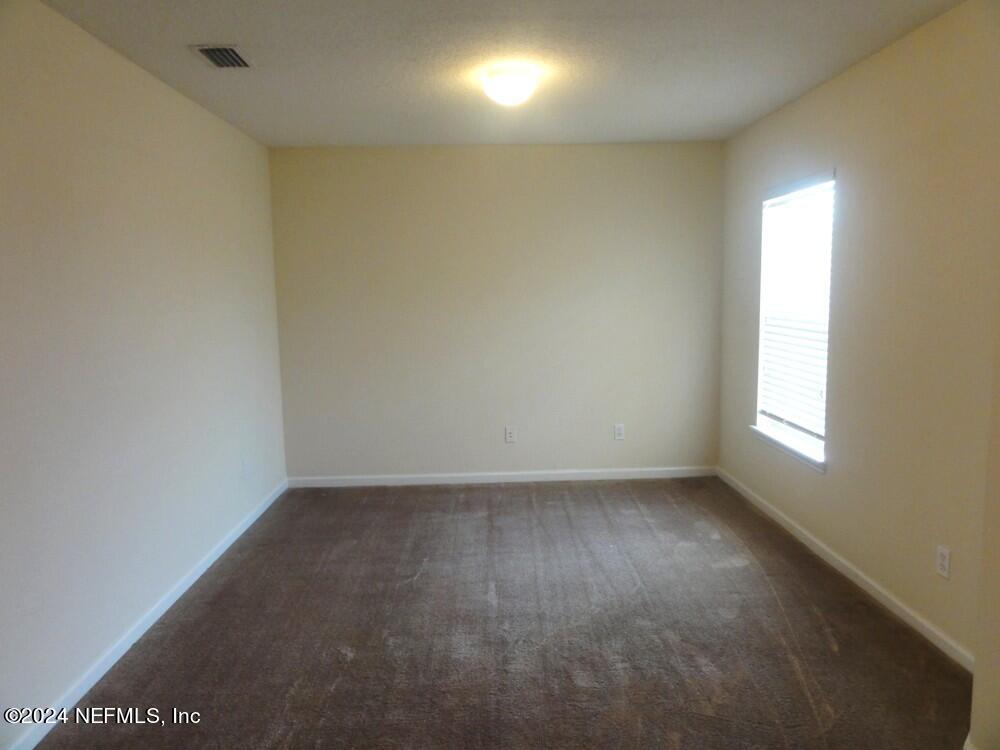 1694 Biscayne Bay Circle Jacksonville, FL 32218 - Photo 13 of 17 an empty room with a window