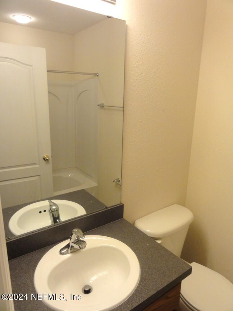 1694 Biscayne Bay Circle Jacksonville, FL 32218 - Photo 14 of 17 a bathroom with a sink and a mirror