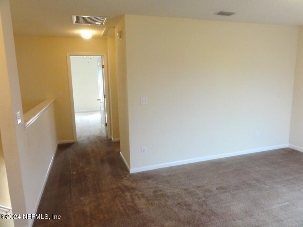 1694 Biscayne Bay Circle Jacksonville, FL 32218 - Photo 8 of 17 a view of a hallway with wooden floor