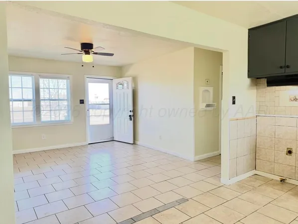 a view of an empty room and window