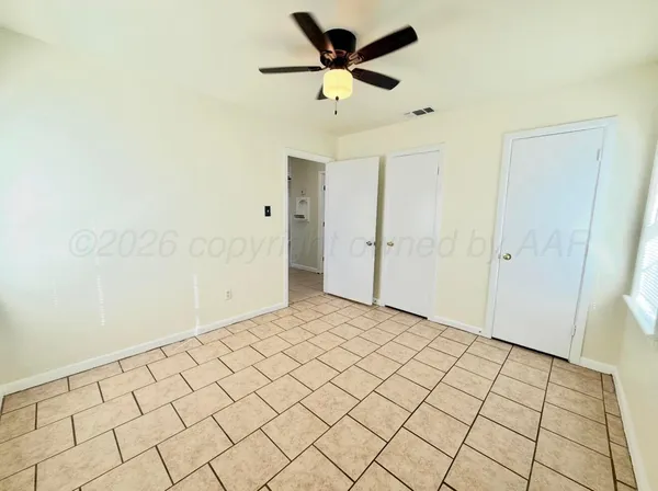 a bathroom with a bathtub shower sink mirror and toilet