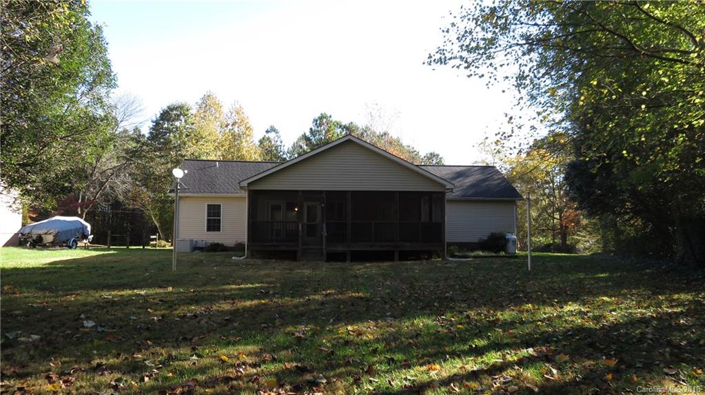 3059 Lake Shore Road South Denver, NC 28037 - Photo 3 of 12 a front view of a house with a yard and trees