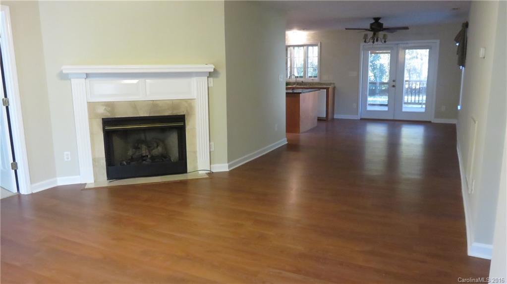 3059 Lake Shore Road South Denver, NC 28037 - Photo 6 of 12 a view of an empty room with window and fire place