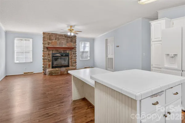 a open kitchen with sink cabinets and wooden floor