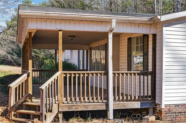 a view of a two chairs on the deck