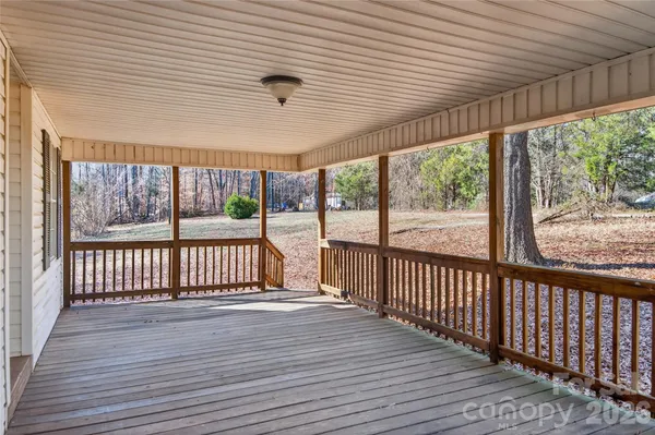 a view of a porch with wooden floor