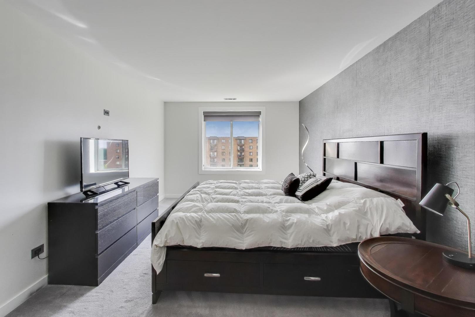 1717 West Crystal Lane, Unit 610 Mount Prospect, IL 60056 - Photo 12 of 23 a bedroom with a bed and a dresser