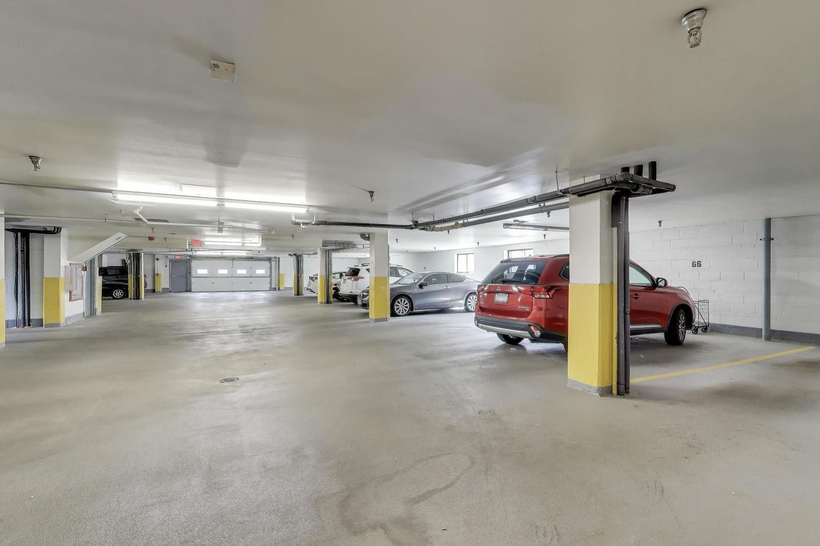 1717 West Crystal Lane, Unit 610 Mount Prospect, IL 60056 - Photo 23 of 23 a view of parking garage with cars