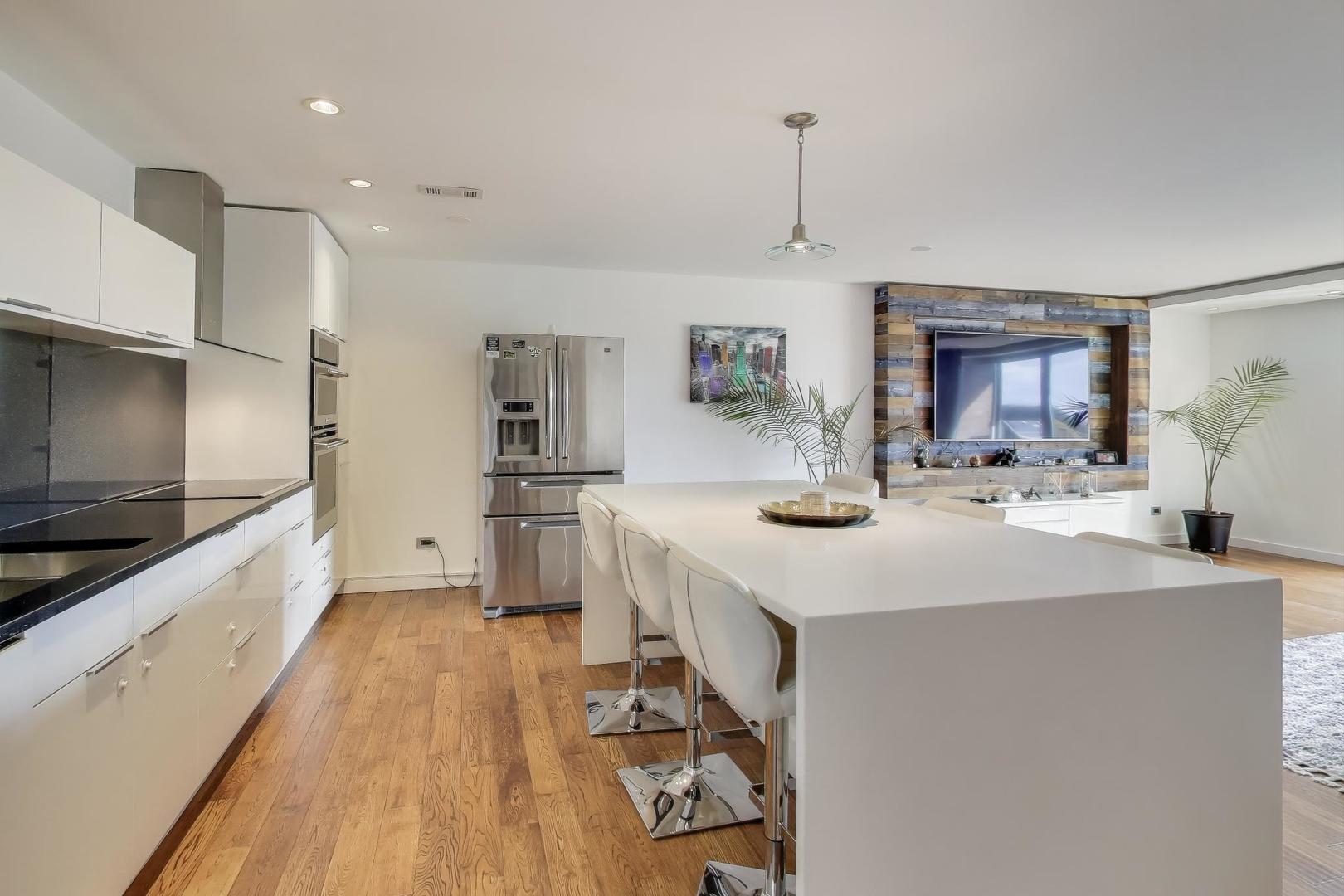 1717 West Crystal Lane, Unit 610 Mount Prospect, IL 60056 - Photo 10 of 23 a kitchen with sink stove and refrigerator