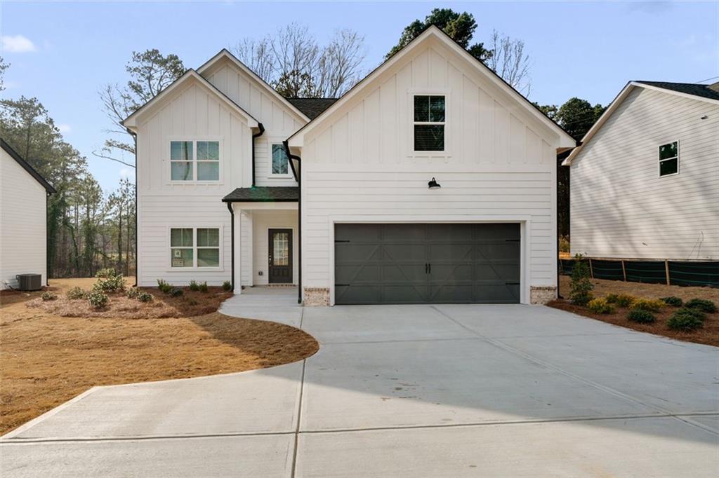 3192 Shadyside Road Southwest Marietta, GA 30008 - Photo 1 of 1 a front view of a house with yard