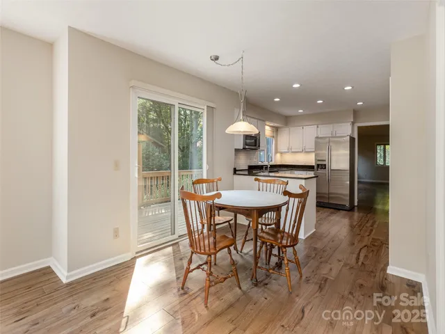 a kitchen with a table and chairs in it