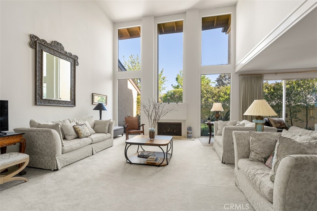 10 Rue Valbonne Newport Beach, CA 92660 - Photo 1 of 66 a living room with furniture and a large window
