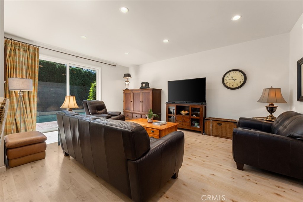 10 Rue Valbonne Newport Beach, CA 92660 - Photo 12 of 66 a living room with furniture and a flat screen tv