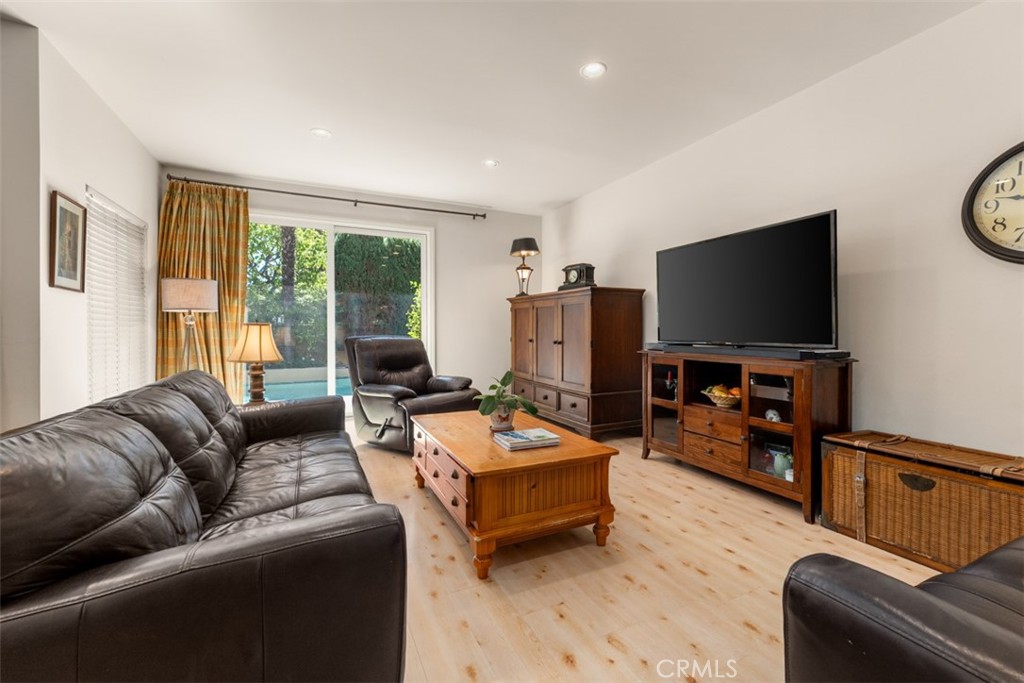 10 Rue Valbonne Newport Beach, CA 92660 - Photo 13 of 66 a living room with furniture and a flat screen tv