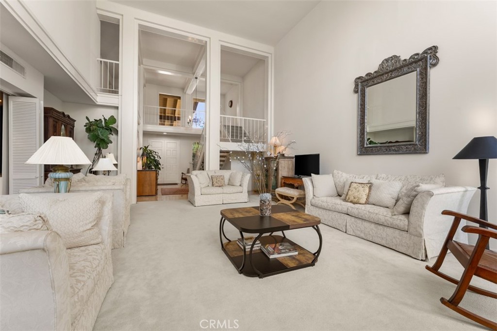10 Rue Valbonne Newport Beach, CA 92660 - Photo 26 of 66 a living room with furniture and a lamp