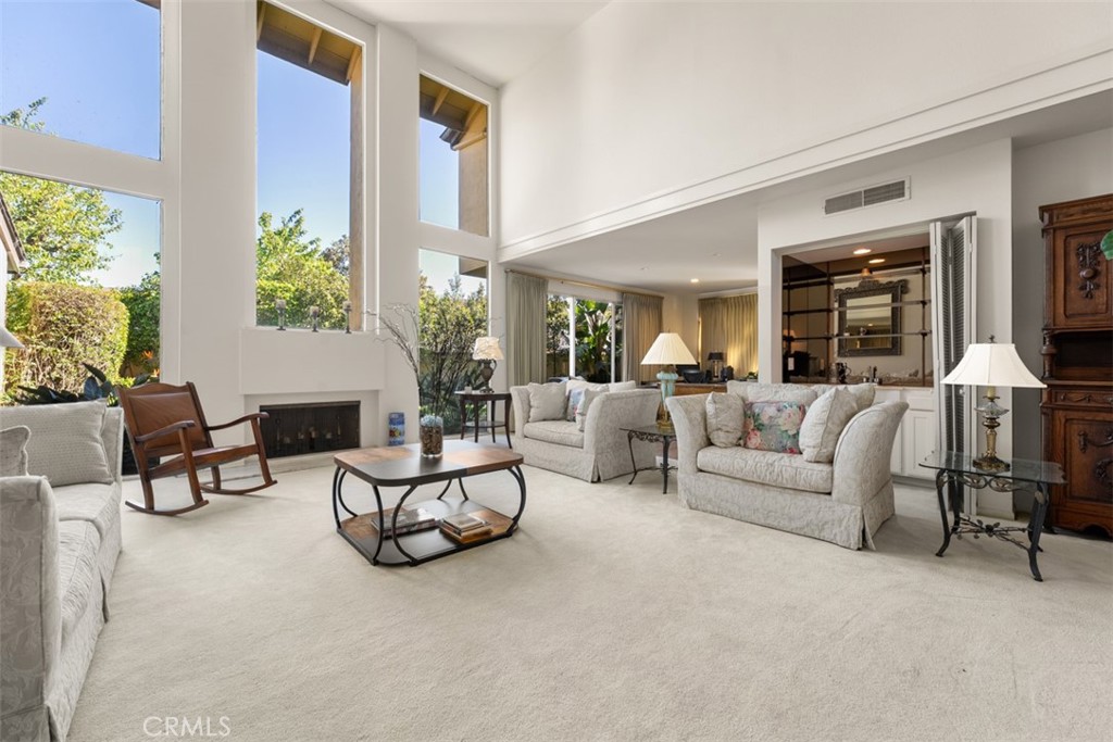 10 Rue Valbonne Newport Beach, CA 92660 - Photo 28 of 66 a living room with furniture and a large window