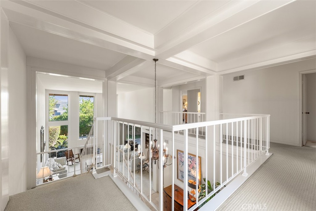 10 Rue Valbonne Newport Beach, CA 92660 - Photo 29 of 66 a view of hallway with wooden floor and stairs
