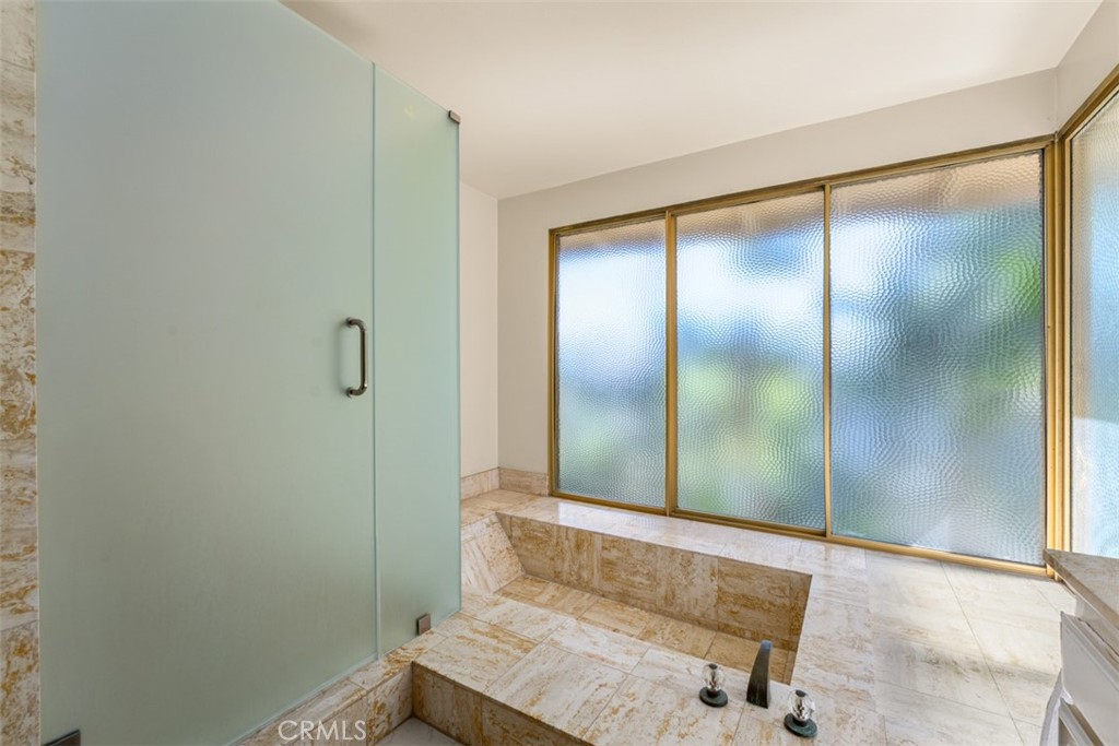 10 Rue Valbonne Newport Beach, CA 92660 - Photo 33 of 66 a bathroom with a granite countertop sink and a mirror
