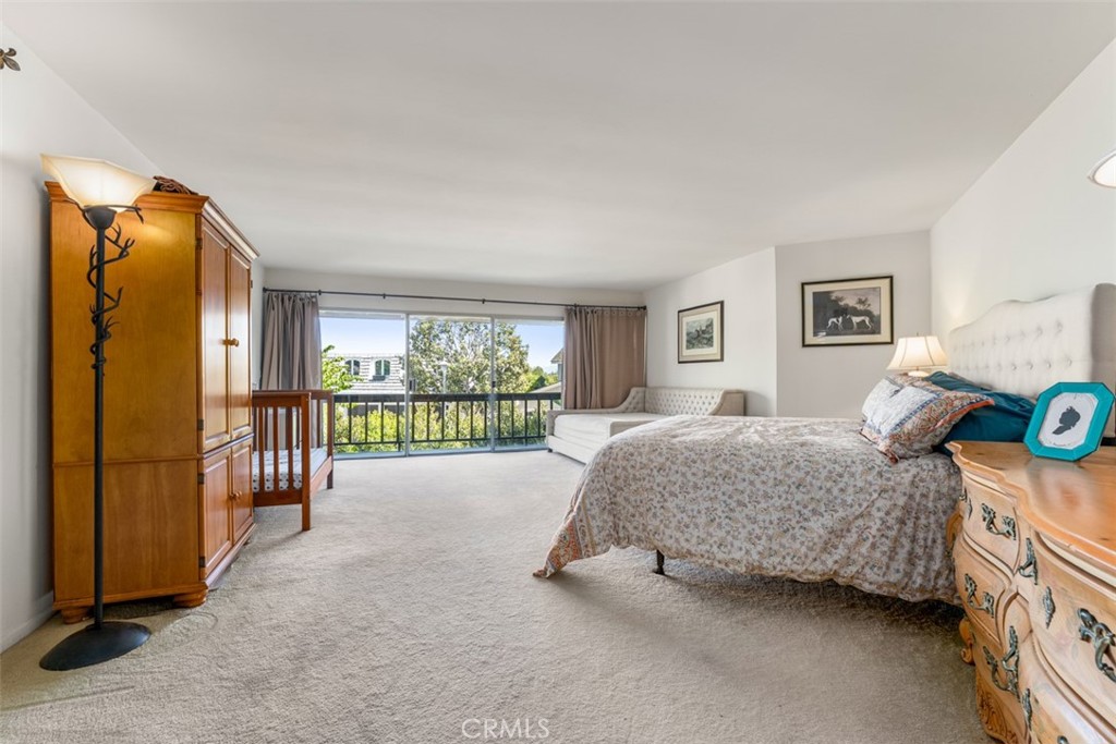 10 Rue Valbonne Newport Beach, CA 92660 - Photo 35 of 66 a bed room with a bed and a large window