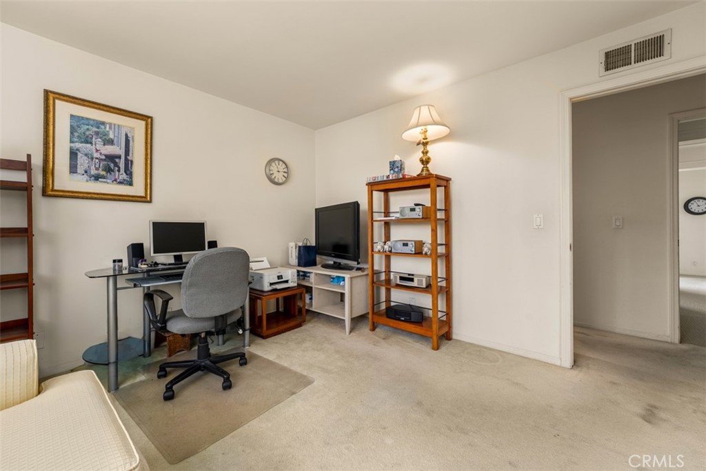 10 Rue Valbonne Newport Beach, CA 92660 - Photo 39 of 66 a view of a workspace with furniture and a window