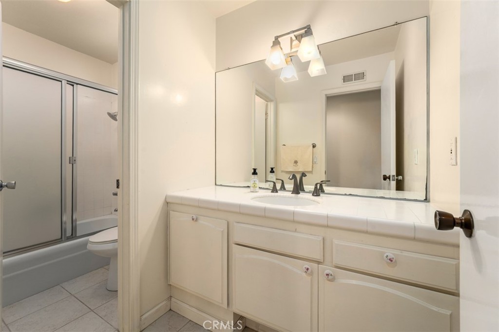 10 Rue Valbonne Newport Beach, CA 92660 - Photo 40 of 66 a bathroom with a sink and a mirror