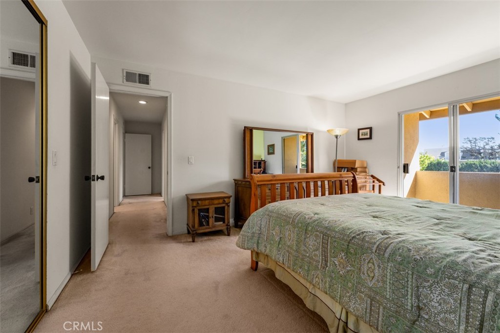 10 Rue Valbonne Newport Beach, CA 92660 - Photo 42 of 66 a bedroom with a large bed and a dresser