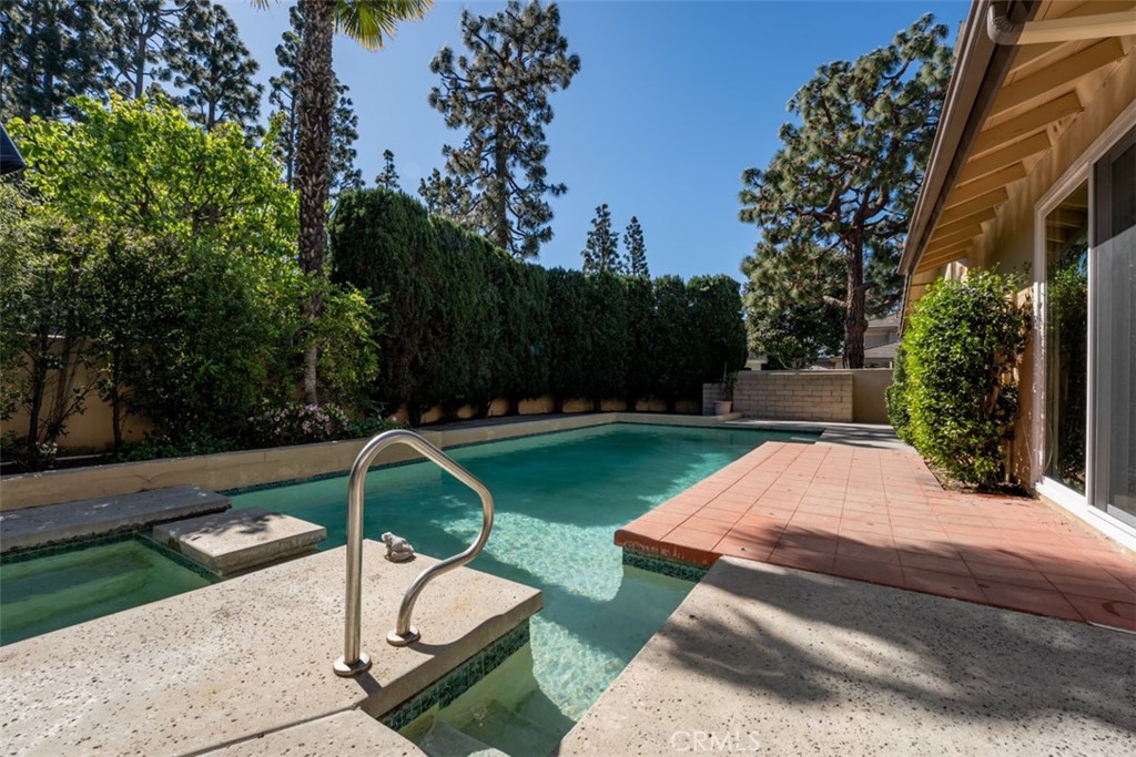10 Rue Valbonne Newport Beach, CA 92660 - Photo 5 of 66 a view of a backyard with plants and a slide