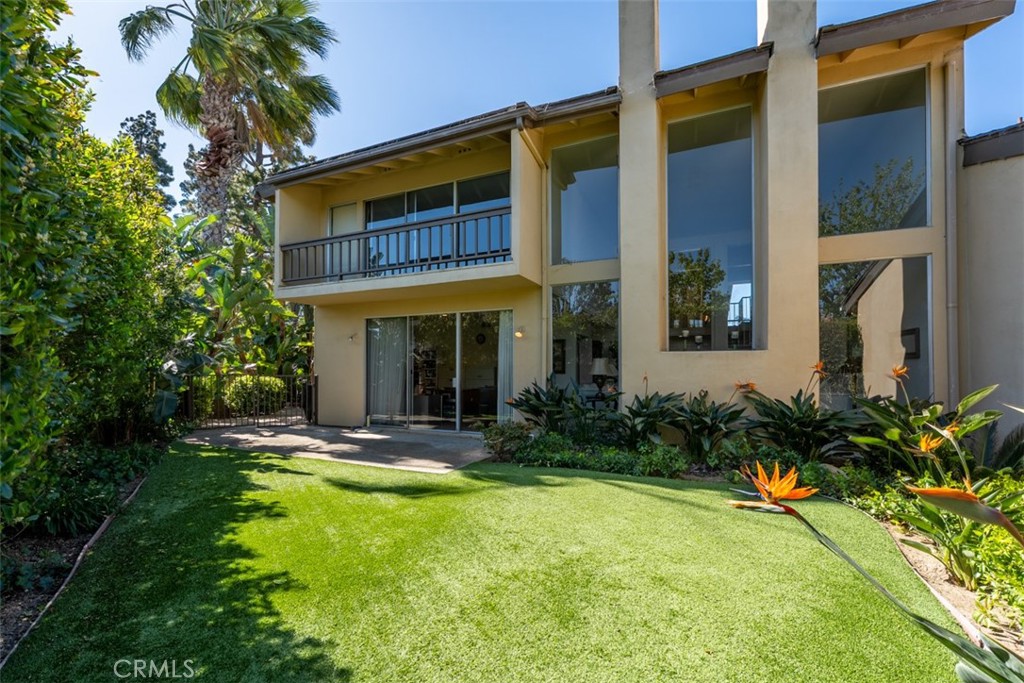 10 Rue Valbonne Newport Beach, CA 92660 - Photo 52 of 66 a view of a house with pool and garden