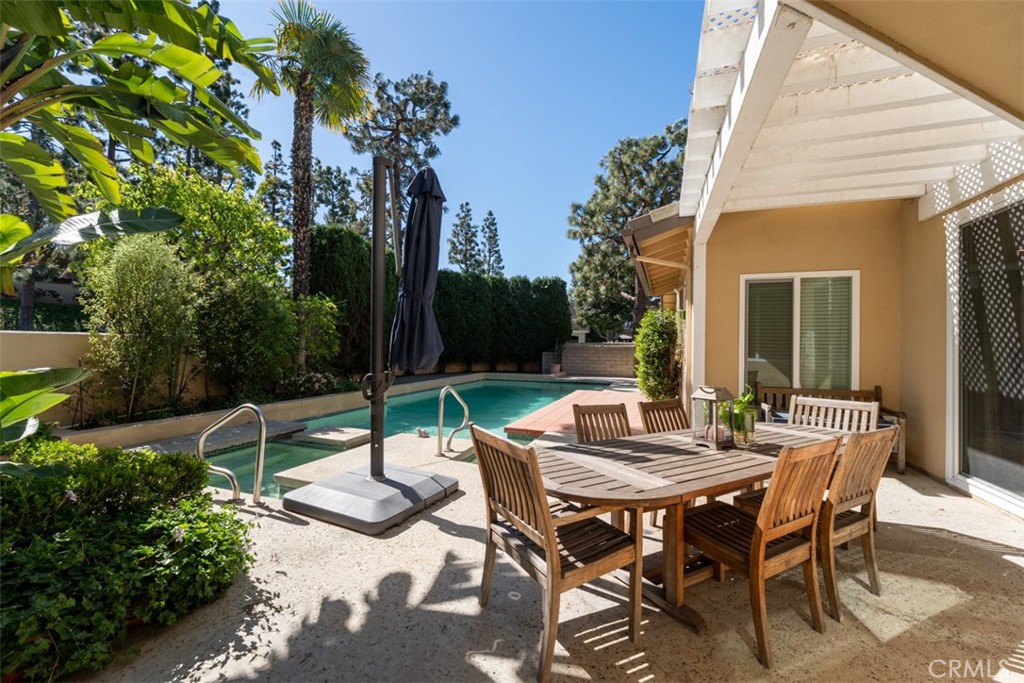 10 Rue Valbonne Newport Beach, CA 92660 - Photo 53 of 66 a view of a patio with a table and chairs